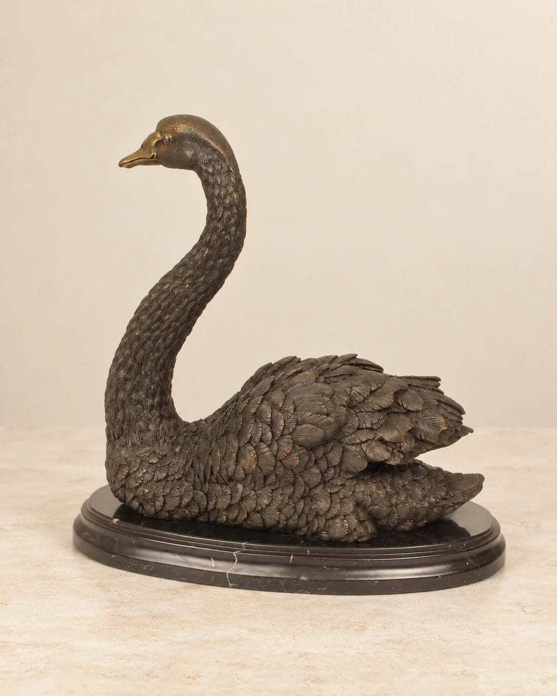 Swan Bronze Sculpture — second view against a warm ivory background