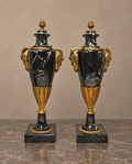Pair of Black Marble Urns with Gilt-Bronze Masks — main view