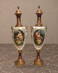 Pair of Monumental Burgundy Porcelain Vases with Pastoral Scenes — main view