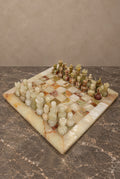 Carved Onyx Chess Set with Variegated Stone Board — main view