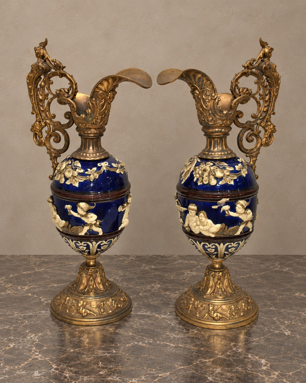 Pair of Cobalt Ceramic Cherub Ewers with Gilt-Bronze Mounts — main view