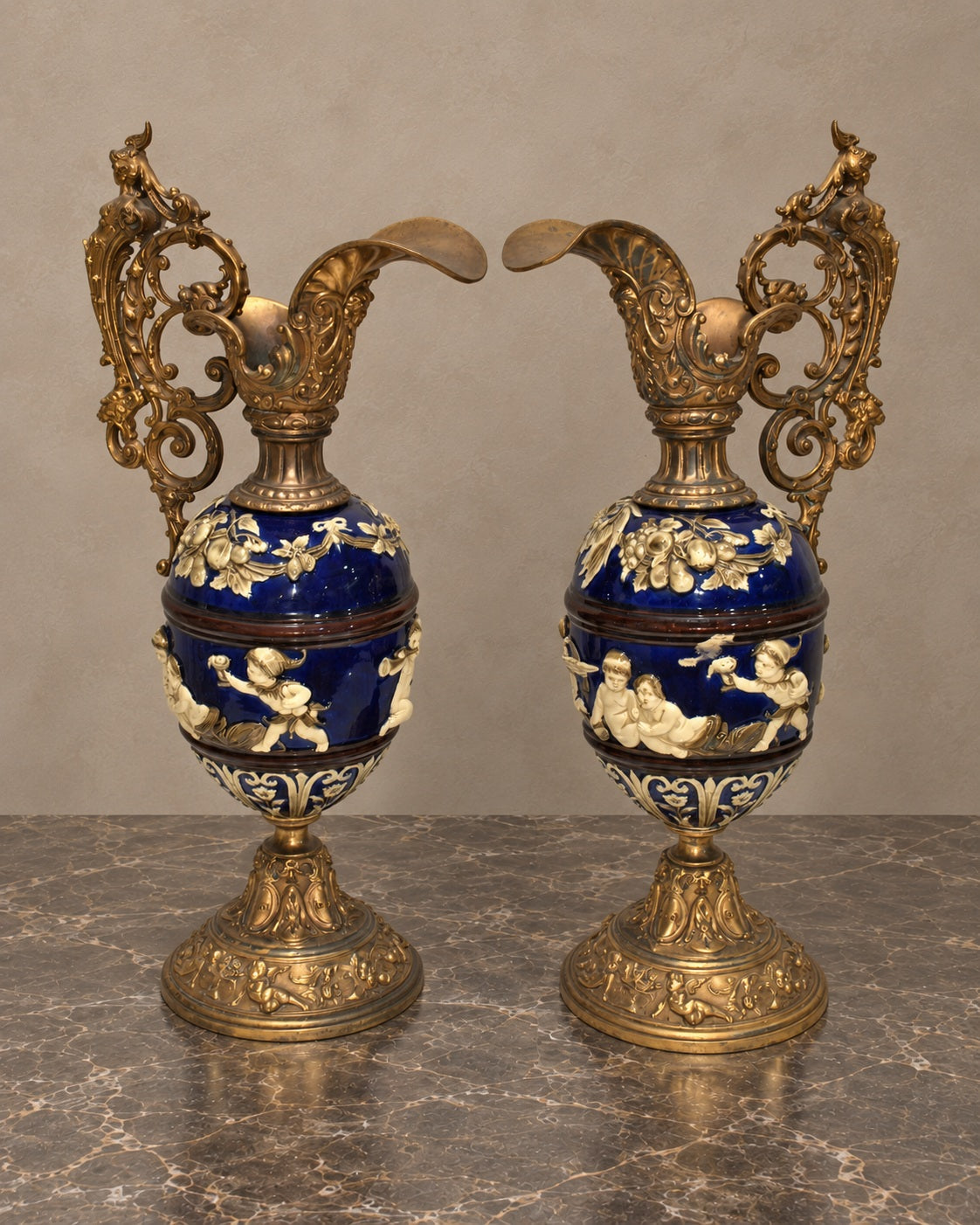 Pair of Cobalt Ceramic Cherub Ewers with Gilt-Bronze Mounts — main view