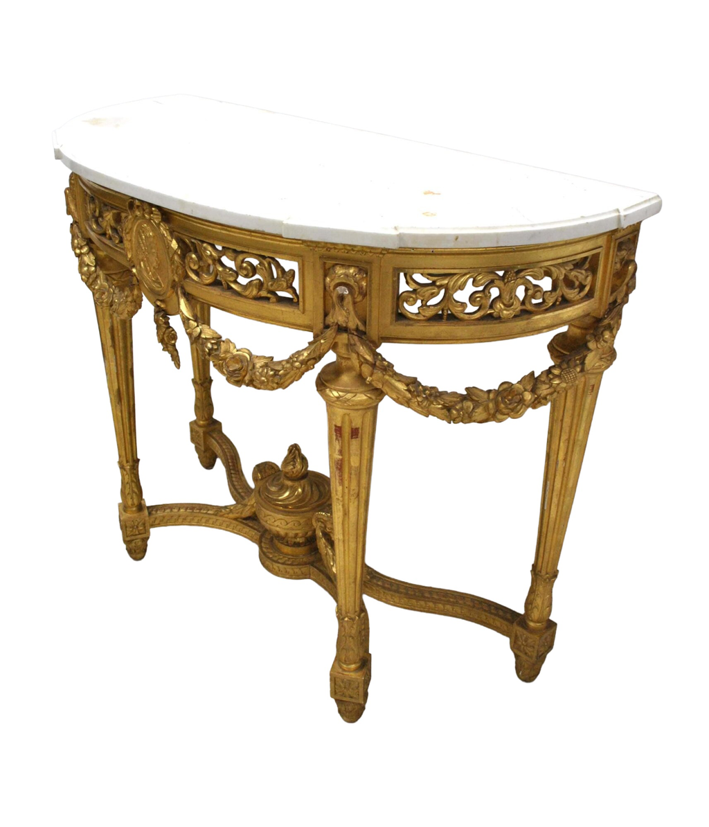 Original oblique view on white showing the demi-lune marble top, surface marks, pierced carving and four legs