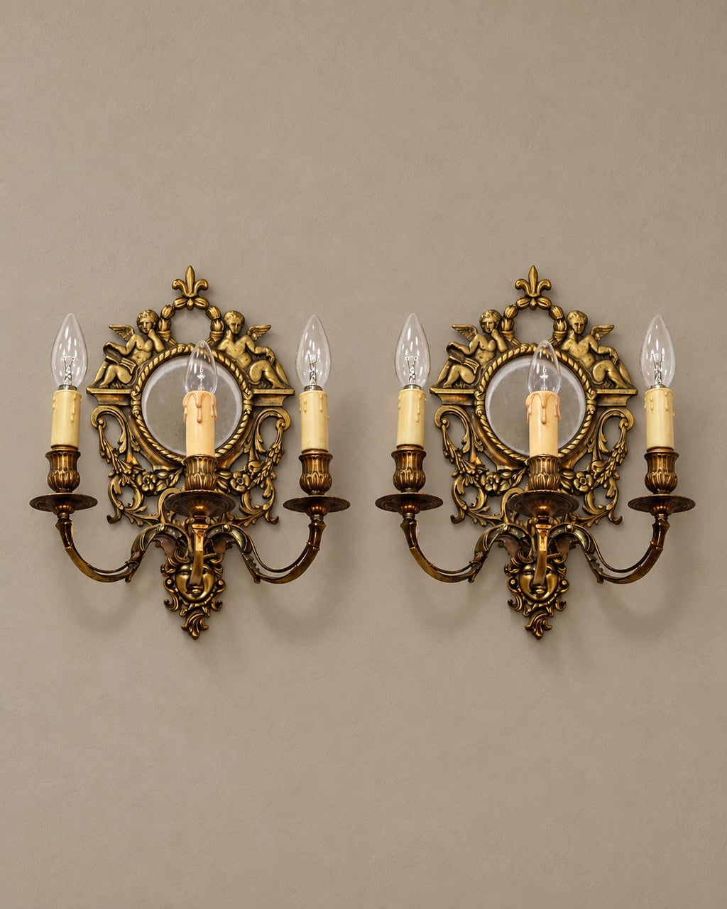 Pair of Louis XVI-Style Cherub Mirror Sconces — styled main view