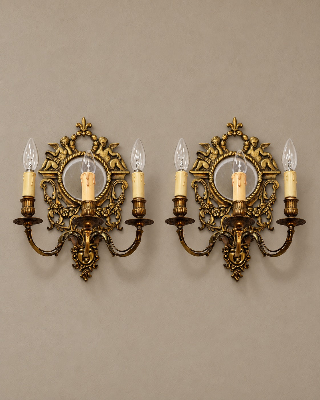 Pair of Louis XVI-Style Cherub Mirror Sconces — styled main view