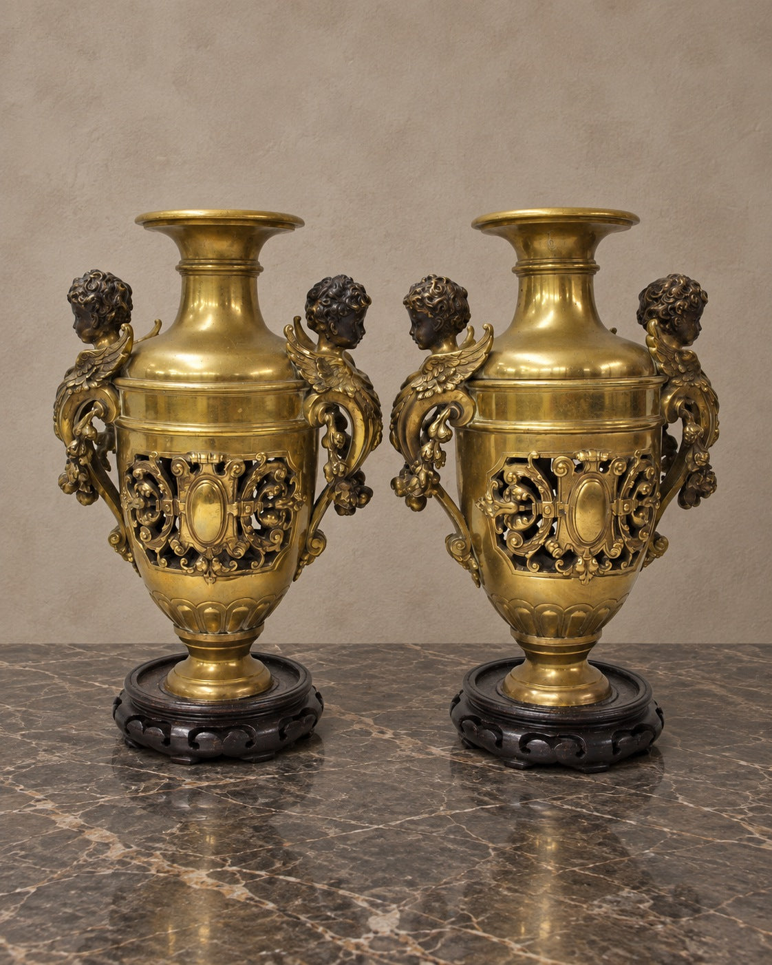 Pair of Bronze Amphora Vases with Cherub Handles — styled main view