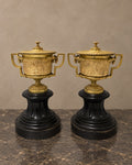Pair of Empire-Style Bronze Covered Urns on Marble — styled main view