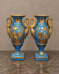 Pair of Turquoise Porcelain Swan-Handled Vases — complete piece in taupe and marble setting