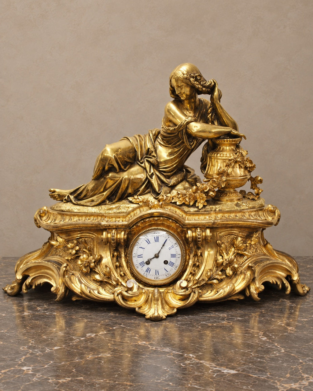 Gilt-bronze figural mantel clock signed A. Carrier, complete front view in taupe and marble setting