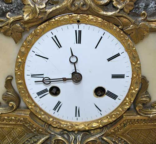 Original close-up of the porcelain dial, Roman numerals, hands and winding apertures