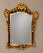 Floral-crest bevelled wall mirror with a neutral silver-grey glass surface, aged ornament and original glass marks