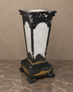 Black and white marble pedestal with gilt-bronze foliate mounts — main oblique view