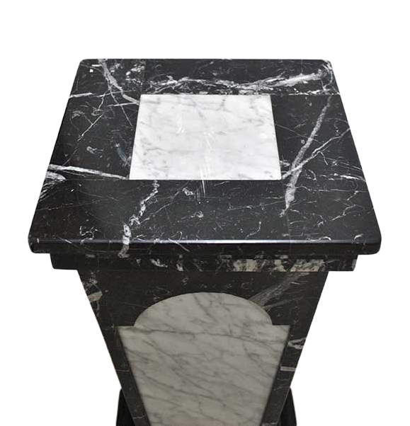 Original elevated view of the pedestal on white, showing the square black marble top and white inset