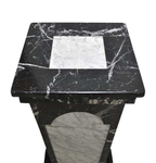 Original elevated view of the pedestal on white, showing the square black marble top and white inset