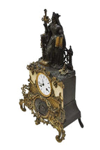 Original oblique view of the mantel clock on white, preserving its metalwork and patina