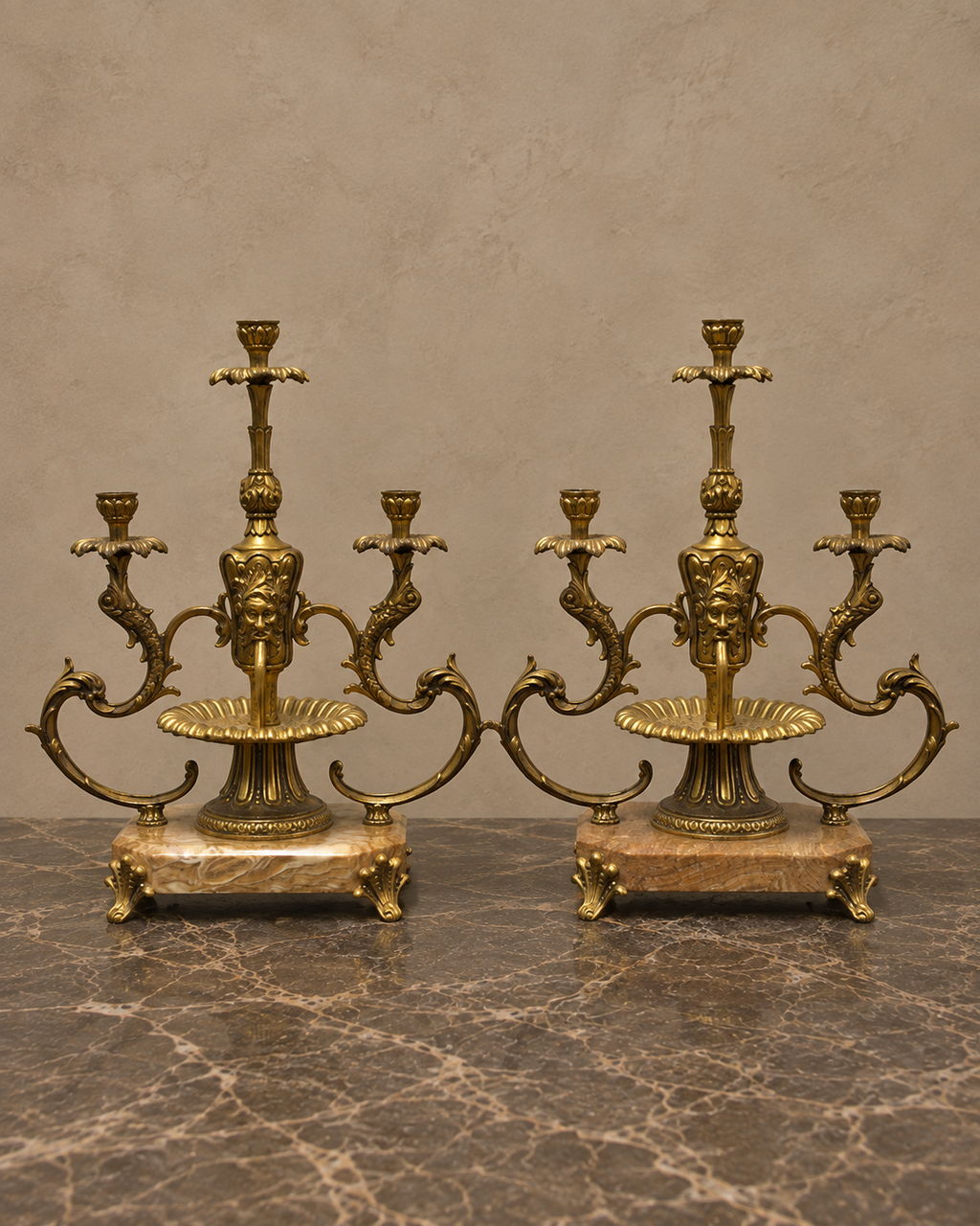 Pair of Three-Light Bronze Candelabra on Marble Bases — styled front view