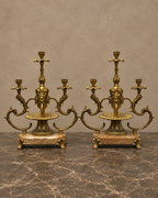 Pair of Three-Light Bronze Candelabra on Marble Bases — styled front view