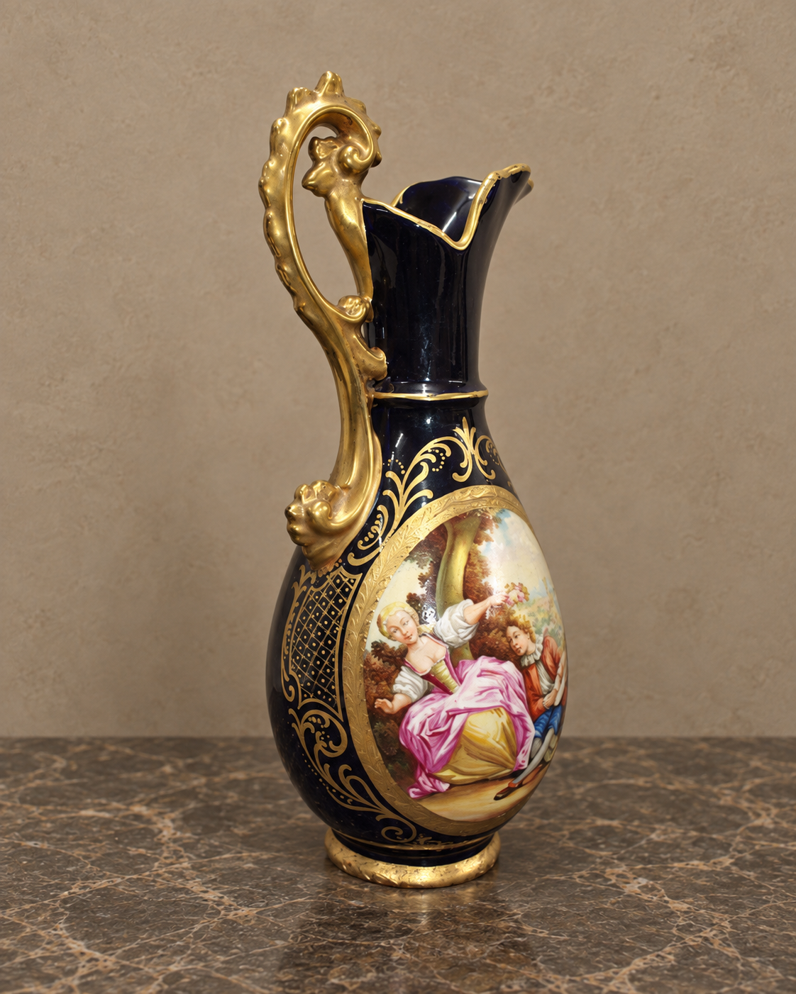 Cobalt Porcelain Ewer with Romantic Scene and Gilt Decoration — styled front view