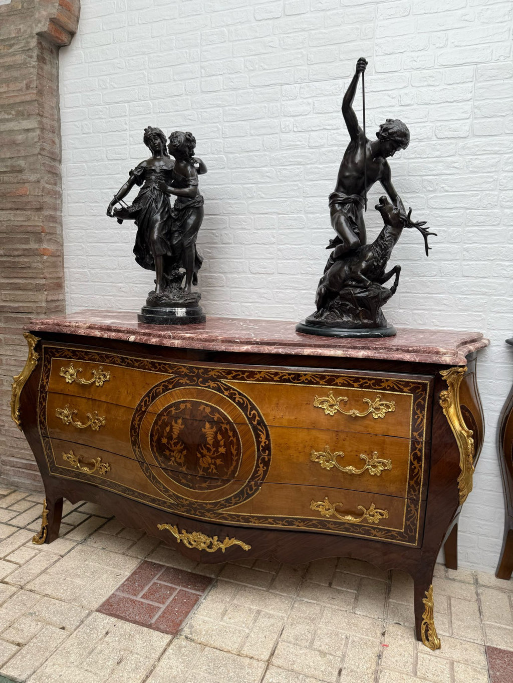 Original front view of the rose marble marquetry chest before background editing. Sculptures are not included.