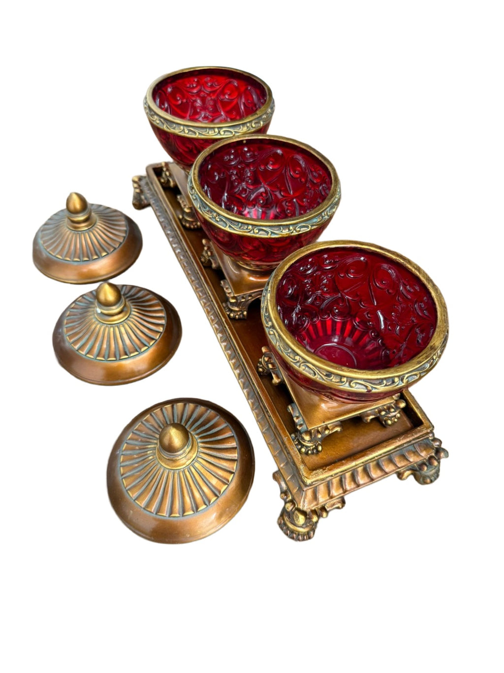 Three Ruby-Tone Covered Jars on an Ornate Stand — additional view on white