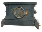 Rear condition view on white, showing worn black finish and exposed wood