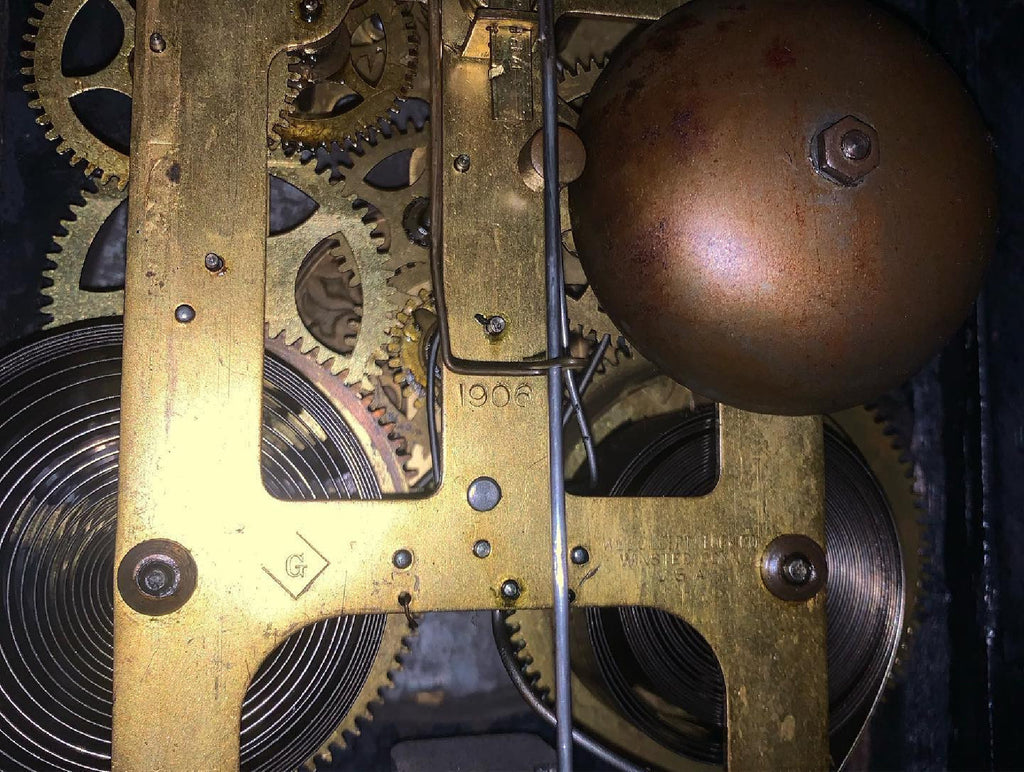 Original clock movement showing the 1906 stamp