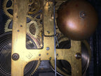 Original clock movement showing the 1906 stamp