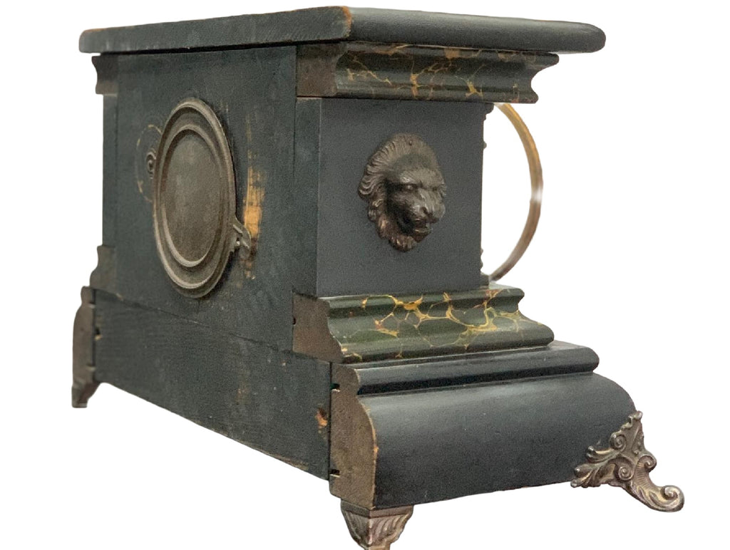 Rear and side view on white, showing lion mask and original finish wear