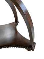 Original detail of the mahogany table showing the supports, shelf and surface wear