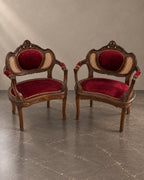 Pair of Napoleon III armchairs with burgundy upholstery and cane back panels