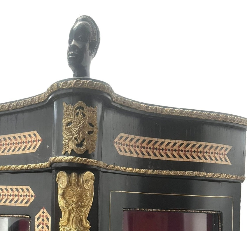 Original cabinet detail showing geometric marquetry, bronze mounts and surface patina