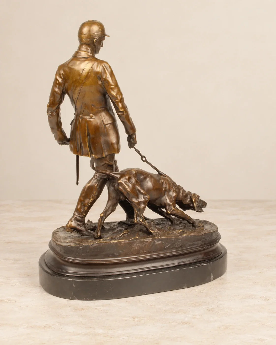 Valet and Bloodhound Bronze Sculpture — second view against a warm ivory background
