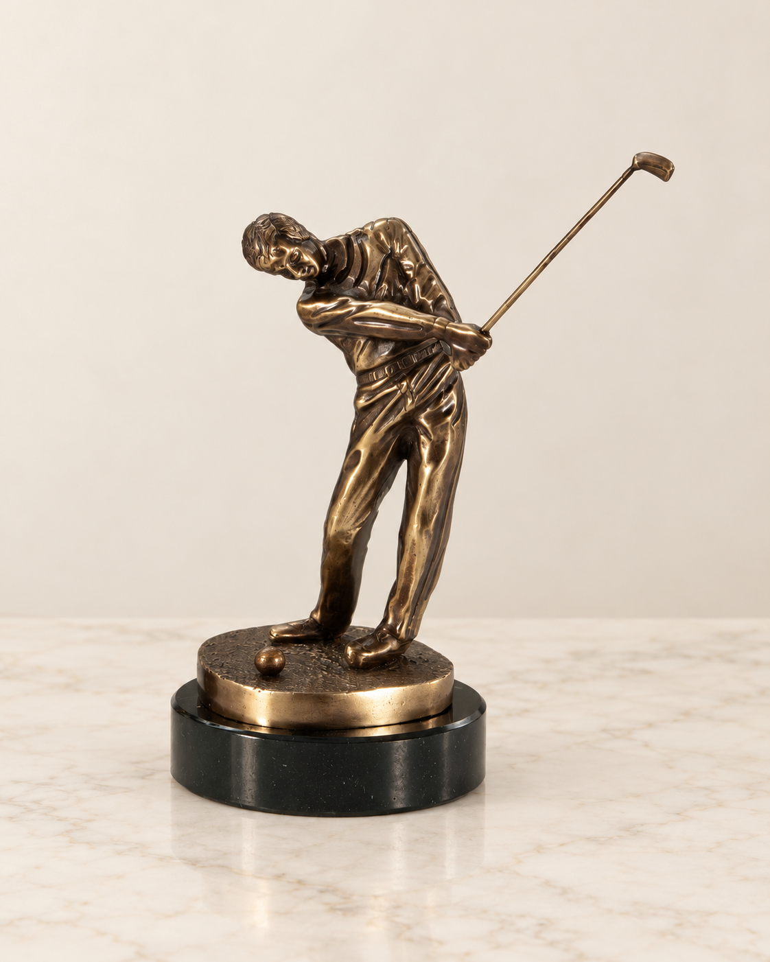 Golfer figurine in mid-swing