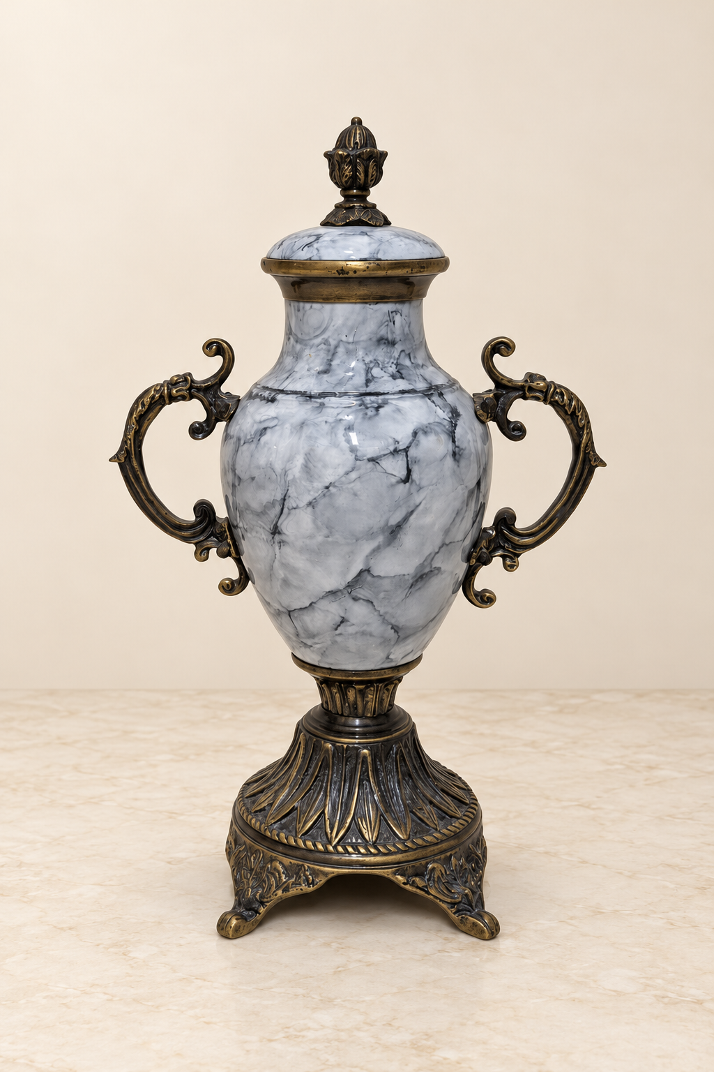 Grey lacquered covered urn with scrolling handles