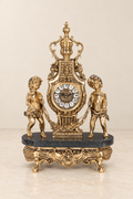 Empire-style mantel clock with two cherubs