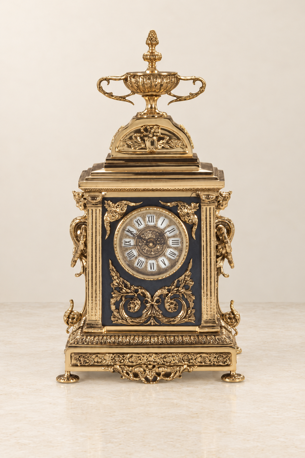 Architectural mantel clock with a two-handled cup finial