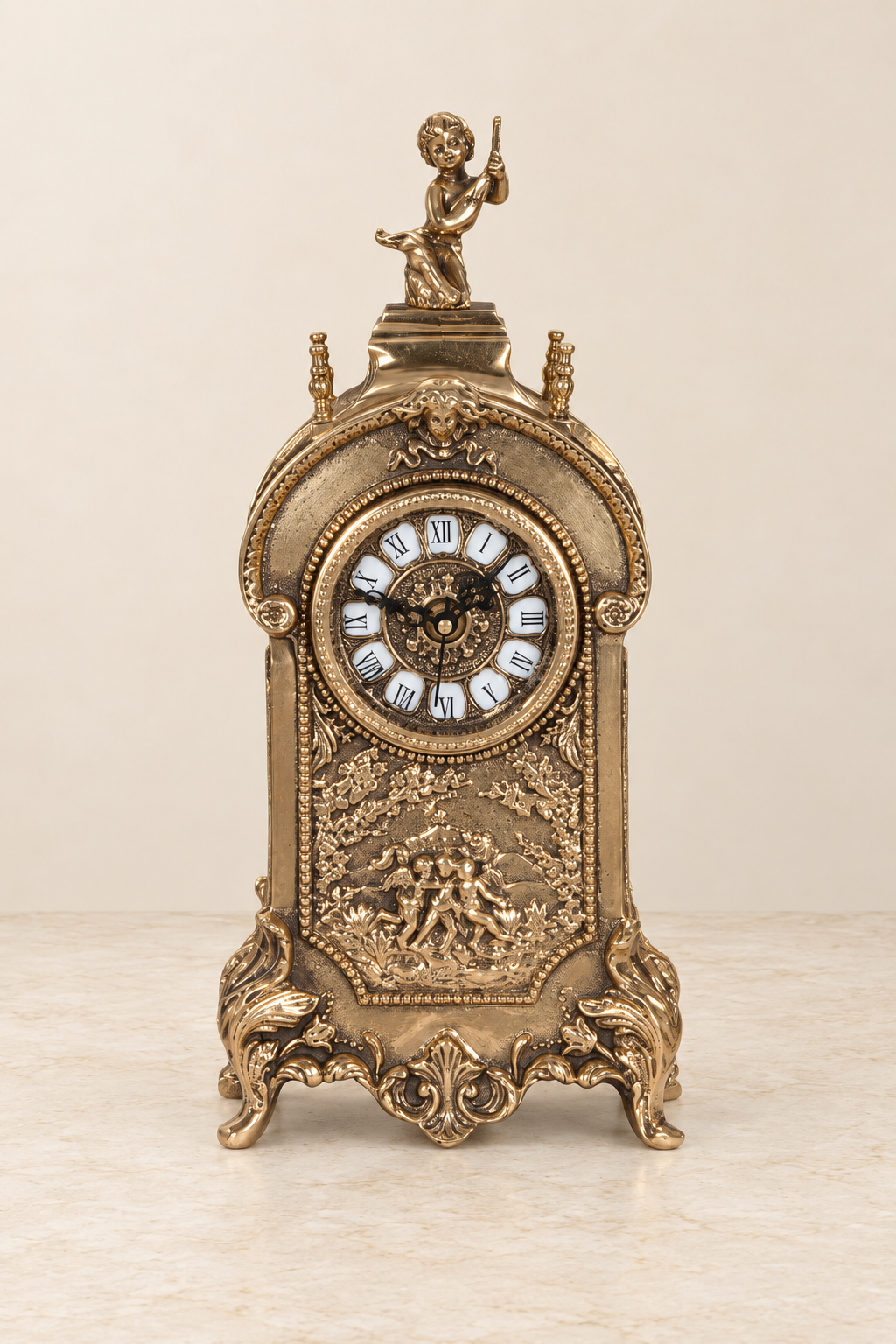 Cherub mantel clock with a figural relief panel