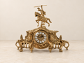 Wide mantel clock with a mounted knight