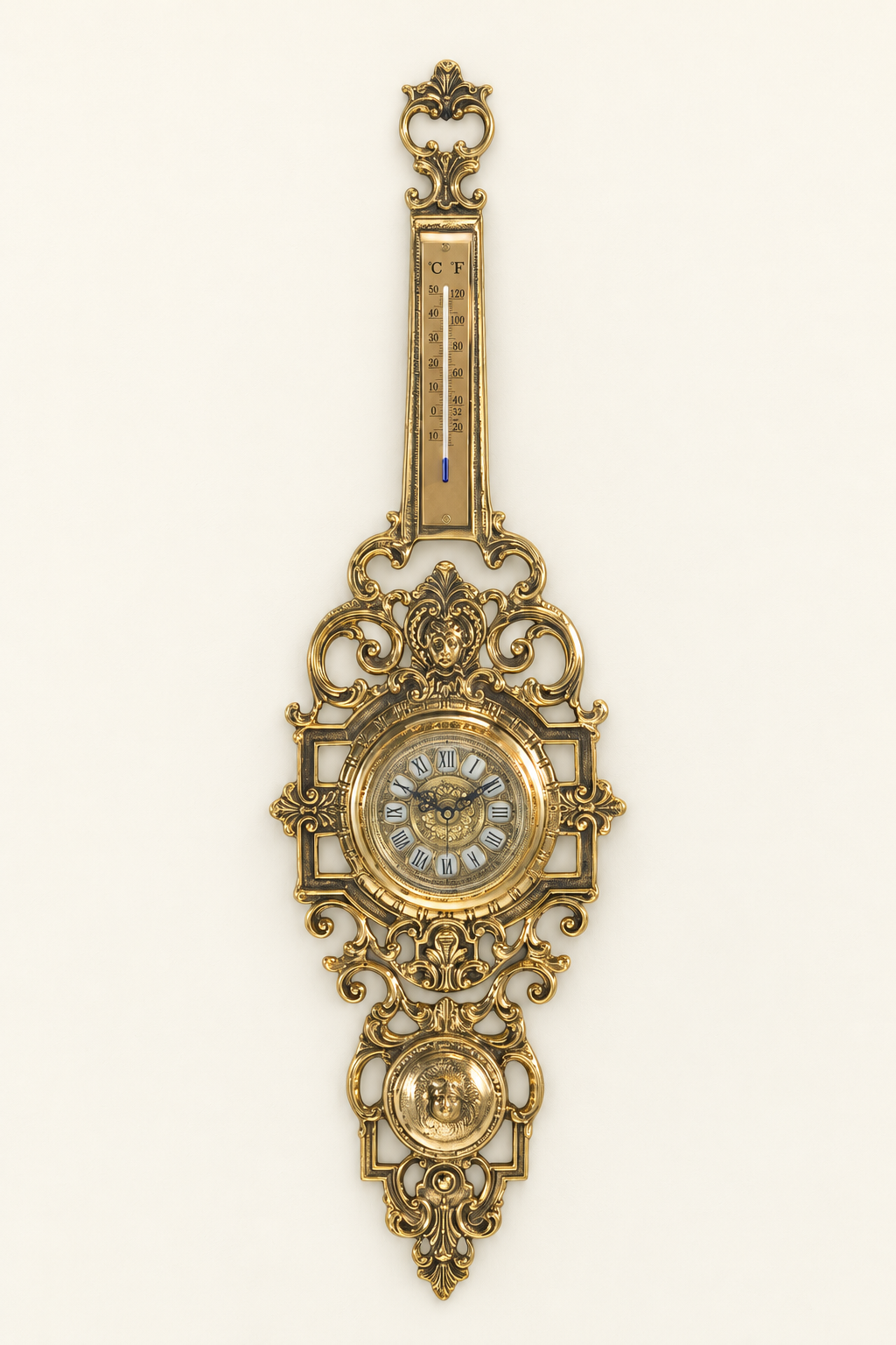 Ornate wall clock with thermometer and geometric frame