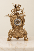 Mantel clock with mounted knight and winged motifs