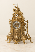 Mantel clock with horseman, lions and twisted columns