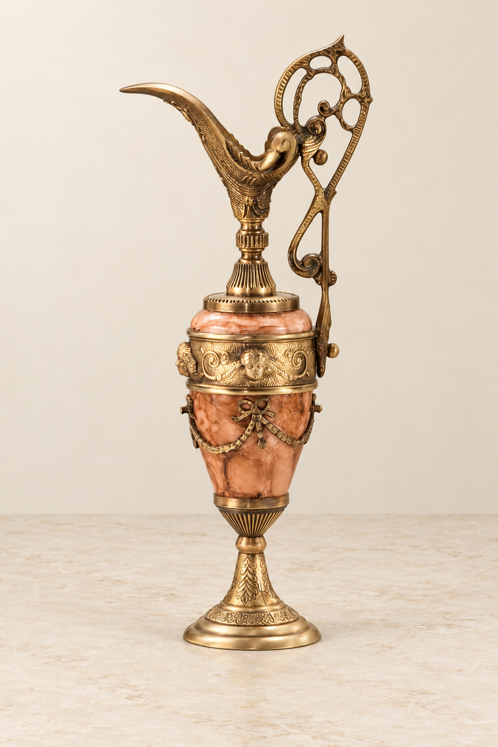 Cleopatra rose-toned decorative ewer with ribbon swags